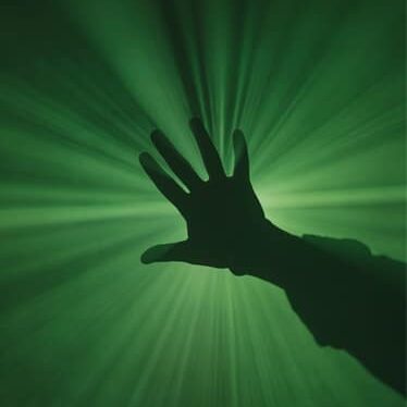 hand in green light